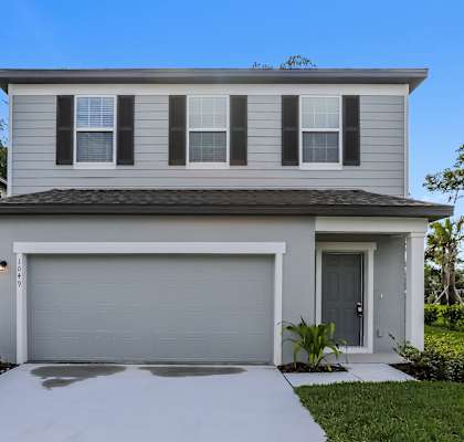 A modern house with a grey garage door.