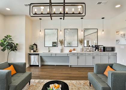 a living room with couches and a coffee table  at Aventura at Hawk Ridge, Lake St Louis