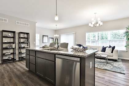 an open floor plan with a kitchen and living room