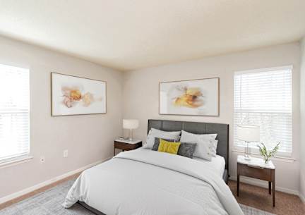 the preserve at ballantyne commons bedroom with large bed and windows