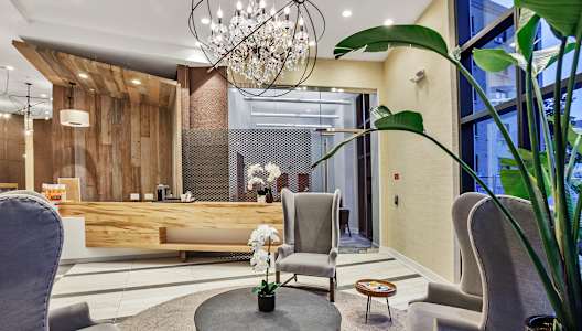 a lobby with two chairs and a coffee table