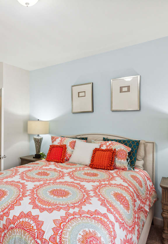 a bedroom with a bed and two night stands