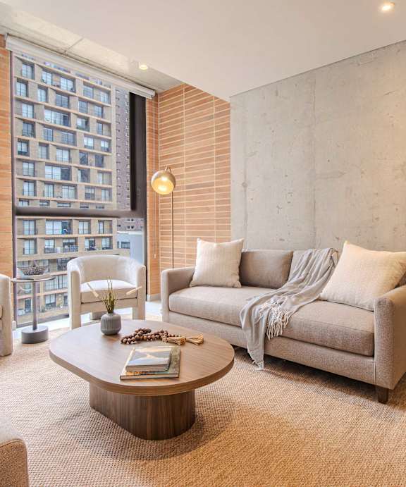 A living room with a couch, armchair, and coffee table.