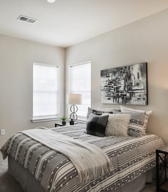 our apartments offer a bedroom with a king sized bed  at Aventura at Hawk Ridge, Lake St Louis