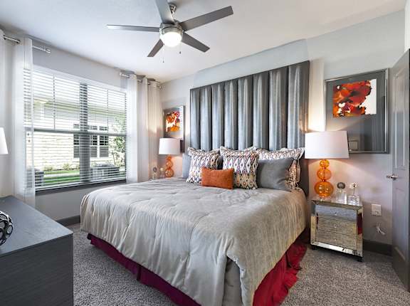 a bedroom with a large bed and a ceiling fan at North Creek, Texas, 78634