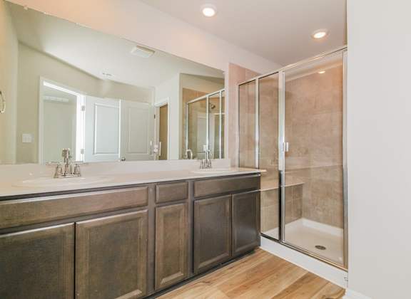 a bathroom with a large sink and a shower
