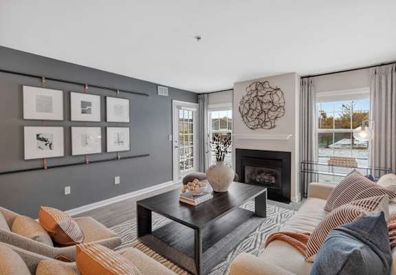 a living room with couches and a coffee table at The Austin Apartment Homes, New Jersey