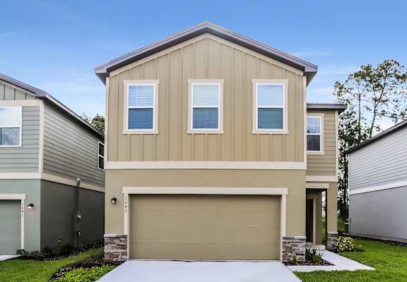 A modern house with a garage door in the front.