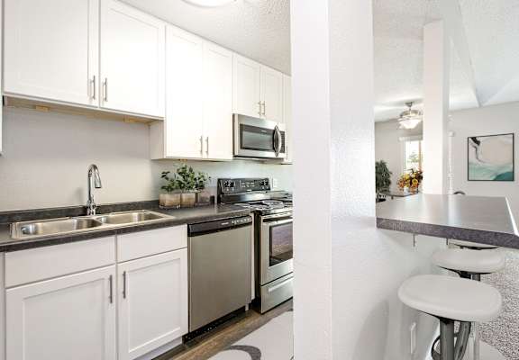 Hinton Height_Cottage Grove_MN_a kitchen with stainless steel appliances and white cabinets