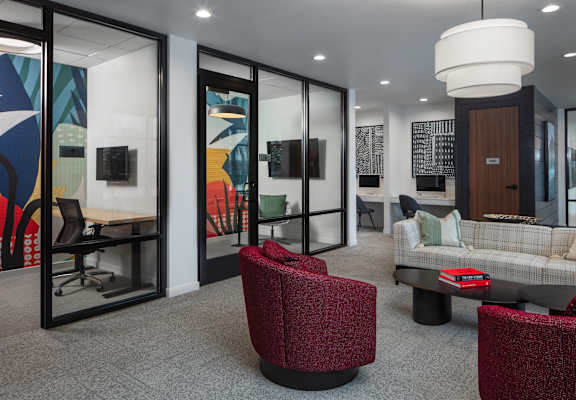 a lounge area with chairs and couches and a table  at 2929 on Mayfair, Wauwatosa
