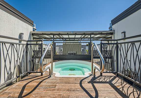 a view of the hot tub from the bottom of the stairs