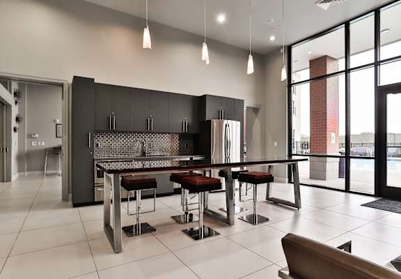 Kitchen clubhouse at The Residences at The Streets of St. Charles Apartments in St. Charles, MO