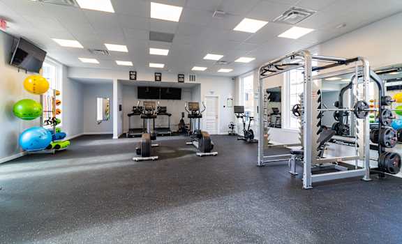 Large fitness room with a lot of exercise equipment at Heritage Apartments, Ohio