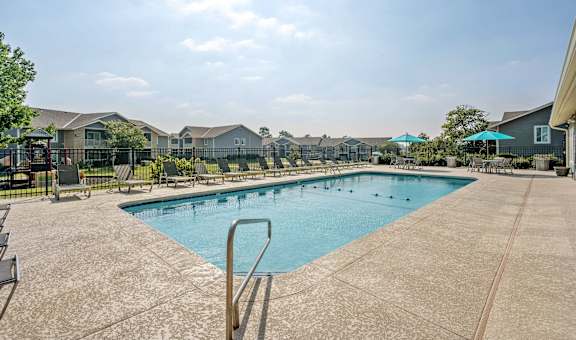 the preserve at ballantyne commons pool with apartment buildings