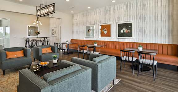 our apartments showcase a naturally well lit living room  at Aventura at Hawk Ridge, Lake St Louis