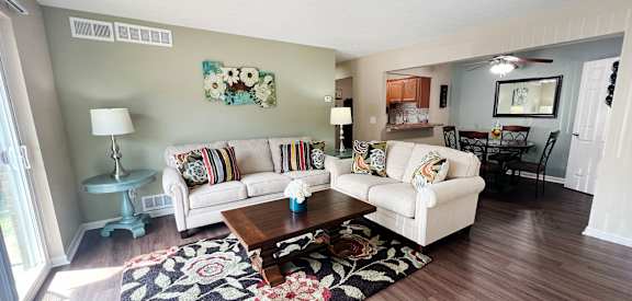 a living room with two couches and a coffee table at Fox Run Apartments, Cincinnati