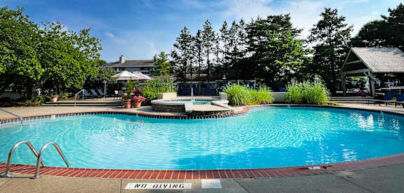 a swimming pool at the resort on a sunny day at Deercross Apartments, Cincinnati, Ohio
