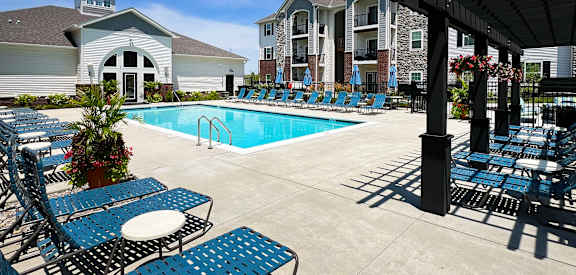 our apartments have a large pool and lounge chairs