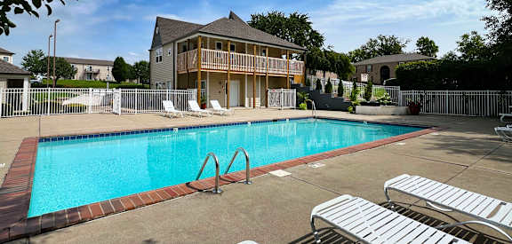 a swimming pool in front of a house at 450 on Keeneland Apartments, Minnesota
