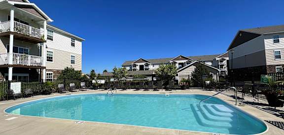the resort style pool is in front of the apartment buildings at Residences at Northgate Crossing, Columbus, OH, 43235