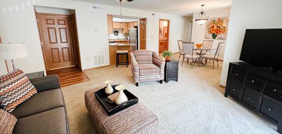 the view of the living room and dining room from the kitchen of a 560 sq  at The Overlook at Ft. Thomas, Ft. Thomas, KY, 41075