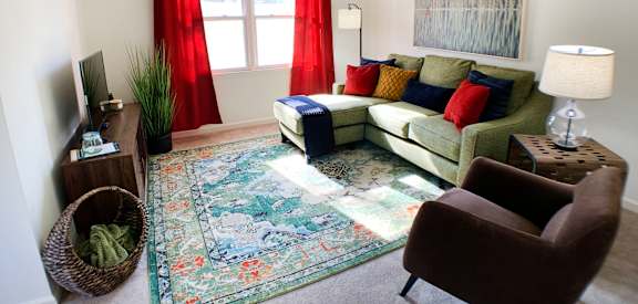 a living room with a couch and chair and a rug  at Hartland Place, Lexington, 40517