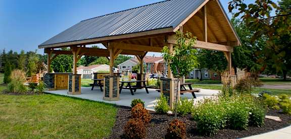 a pavilion with picnic tables in a park  at Steeplechase Apartments, Loveland, 45140