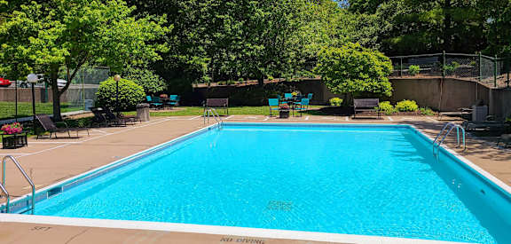 a swimming pool in a backyard with trees at Indian Lookout Apartments, Cincinnati, OH, 45238