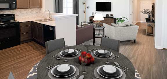 a dining room table in front of a kitchen and living room  at Aberdine Place, Kentucky