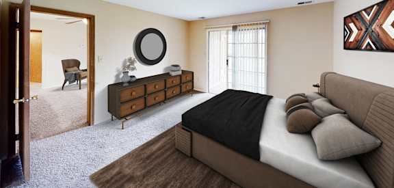 a bedroom with a bed and a dresser  at Woodhills Apartments, West Carrollton, Ohio