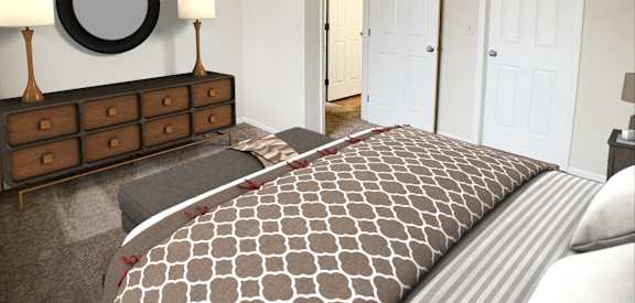 a bedroom with a bed and a dresser and a mirror  at Forest Creek Apartments, Ohio