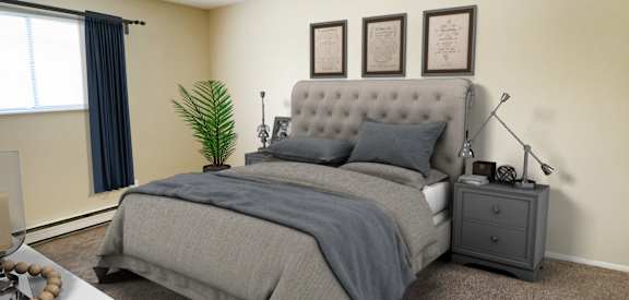 a bedroom with a bed and a dresser and a window at Crown Station Apartments, Amelia