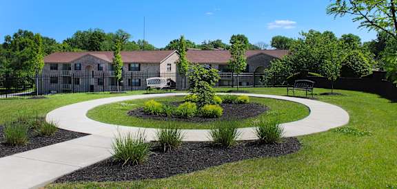 a park with a pathway and a building in the background  at Four Worlds Apartments, Cincinnati, OH