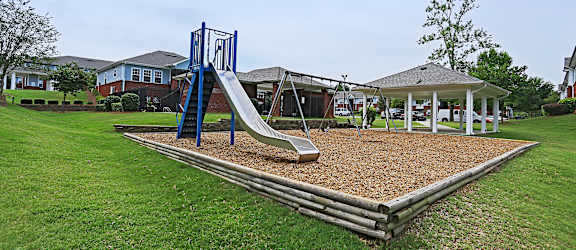 A Playground With a Blue Slide at Magnolia Court Apartments, Birmingham, AL, 35215