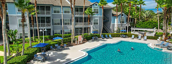 Refreshing pool, lounge chair and umbrellas