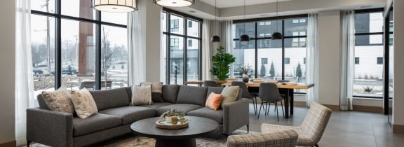a rendering of a rooftop patio with tables and chairs and a television