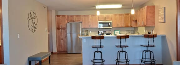 a kitchen with a stove top oven next to a sink