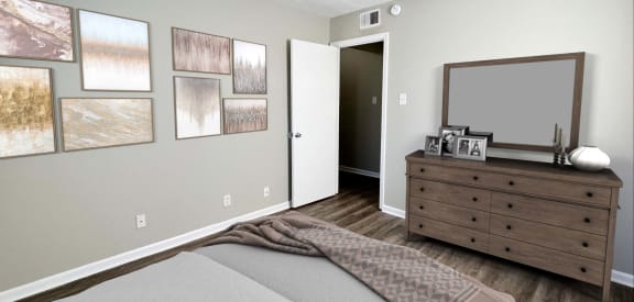 a bedroom with a bed and a dresser with a mirror at Park Place, Richmond, KY, 40475