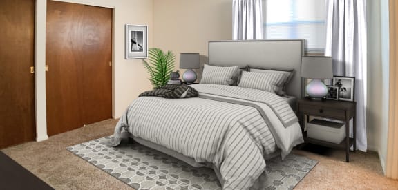a bedroom with a bed and a closet  at Four Worlds Apartments, Cincinnati, OH