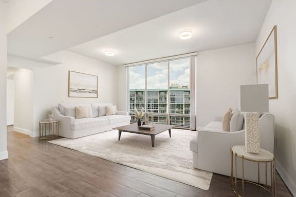 a living room with a couch and a coffee table at Paramount on Lake Eola, Orlando