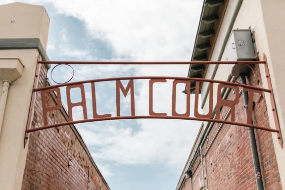 a sign that reads hillcrest on a brick building