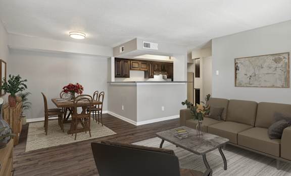 A living room with a dining table and chairs.