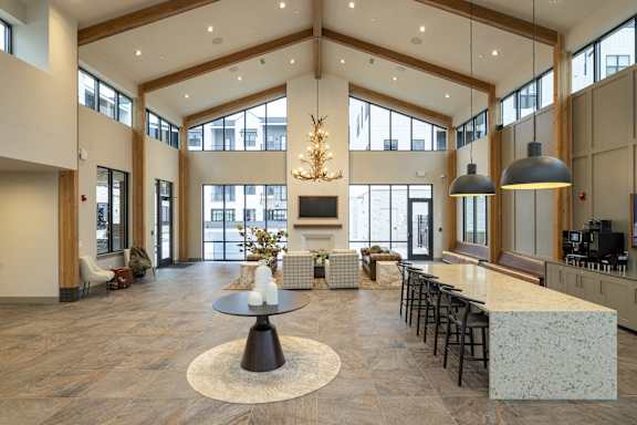 A large open space with a table and chairs in the center.