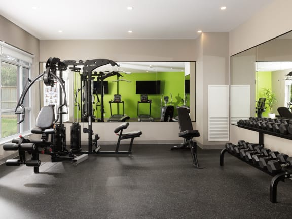 a rendering of a gym with weights and other exercise equipment at 101 Base Line Road West, London, ON