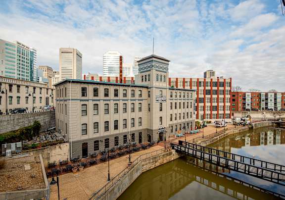 A cityscape with a bridge over a canal.