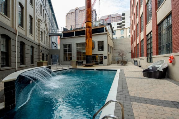 Pool with a Waterfall at The Locks Apartments, Richmond, 23219