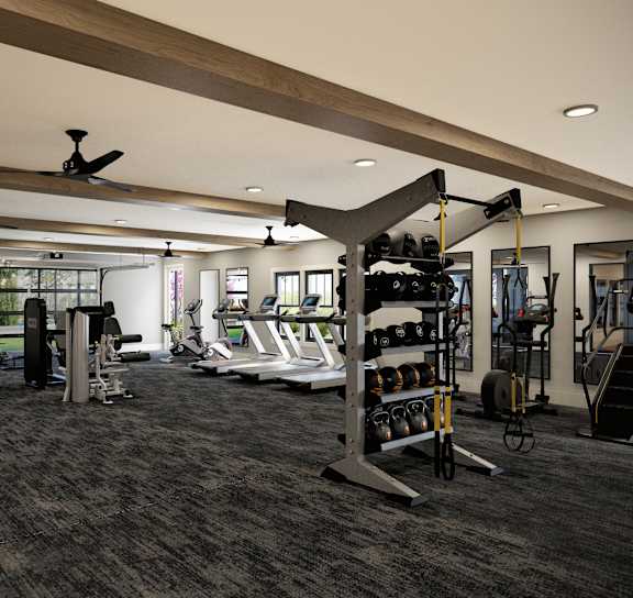 A spacious gym with a variety of equipment including treadmills, weights, and exercise machines.