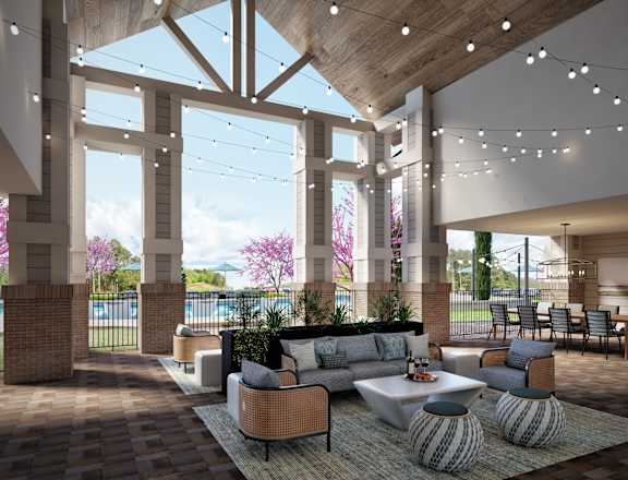 A modern living room with a large window and a view of the outdoors.