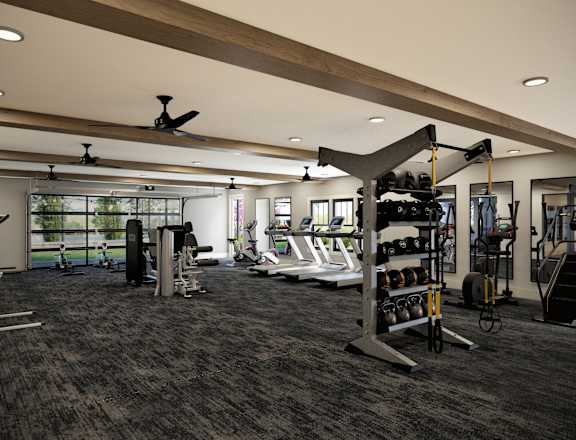 A spacious gym with a variety of equipment including treadmills, weights, and exercise machines.