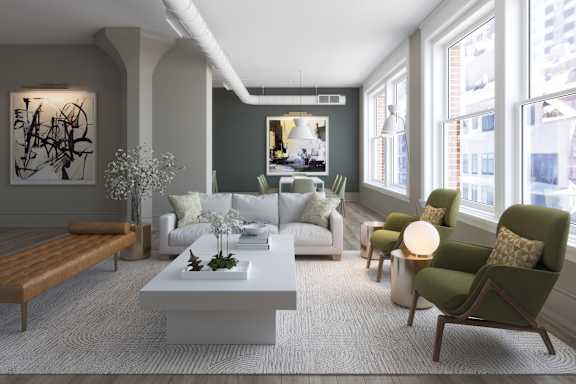 A modern living room with a white coffee table and green armchair.at East 4th Street, Cleveland, OH